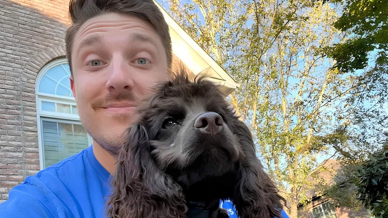 Dog Owners Academy trainer with a Cocker Spaniel client during in-home dog training in Charlotte, NC